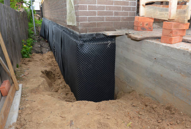 Happy homeowners after waterproofing job in Delmont